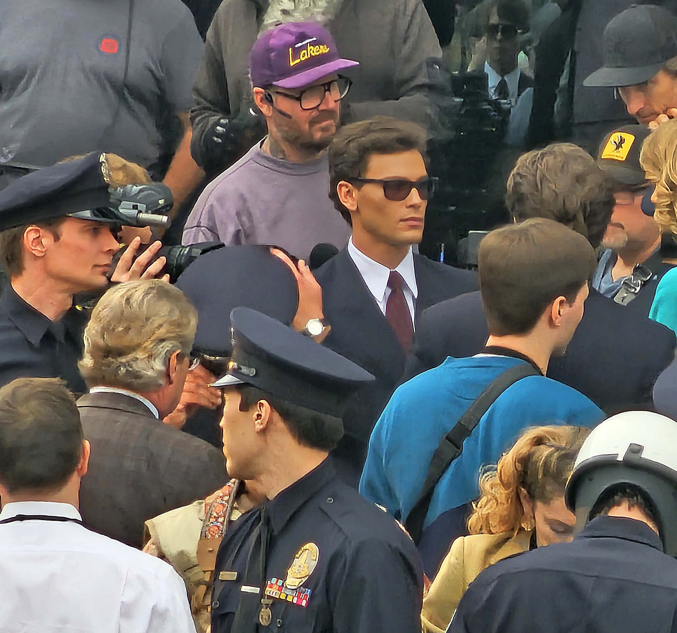 Monsters: The Lyle And Erik Menendez Story Filming 1st Outdoor Court Scene With Actors Cooper Koch And Nicholas Alexander Chavez In Suits As Press And Police Walk With Them Inside On Location In Los Angeles 24 Jan 2024