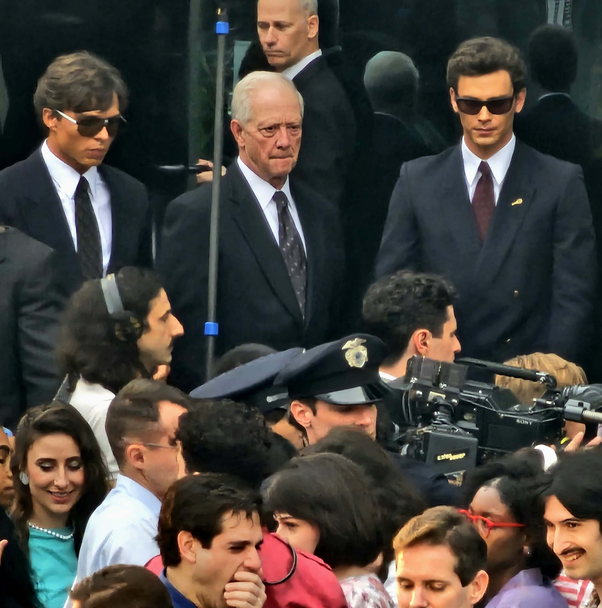 Monsters: The Lyle And Erik Menendez Story Filming 1st Outdoor Court Scene With Actors Cooper Koch And Nicholas Alexander Chavez In Suits As Press And Police Walk With Them Inside On Location In Los Angeles 24 Jan 2024