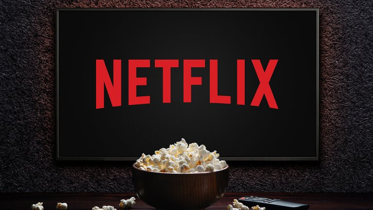 Netflix,Logo,On,Tv,With,Popcorn,Bowl,And,Reomote,Control